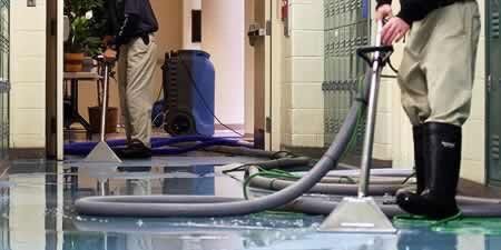 Water damage restoration in progress in a flooded room